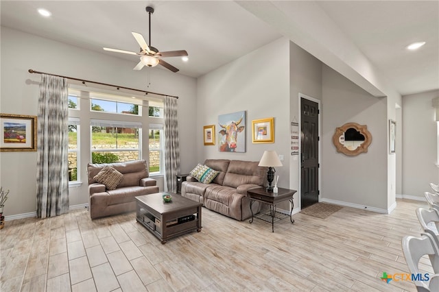 220 Bolivar Way Unit 101, San Marcos, TX 78666 - living room featuring ceiling fan, baseboards, light wood-style flooring, a high ceiling, and recessed lighting
