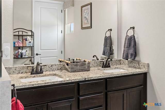 220 Bolivar Way Unit 101, San Marcos, TX 78666 - bathroom featuring double vanity