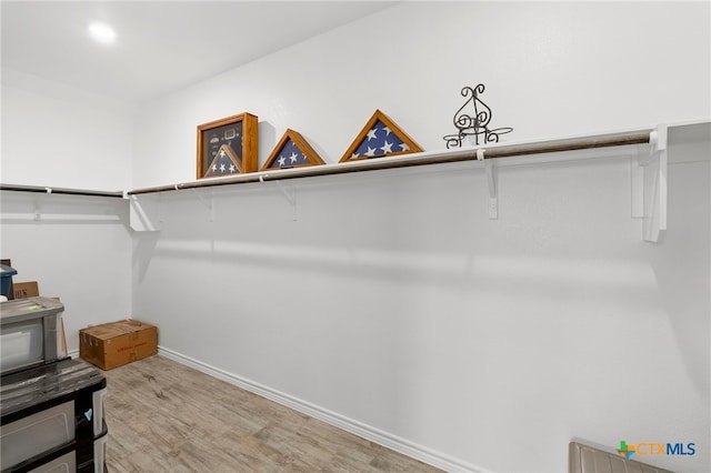 220 Bolivar Way Unit 101, San Marcos, TX 78666 - walk in closet with light wood finished floors
