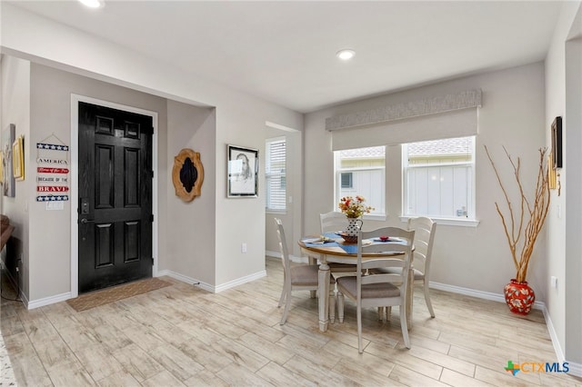 220 Bolivar Way Unit 101, San Marcos, TX 78666 - dining room with baseboards, light wood-style floors, and recessed lighting