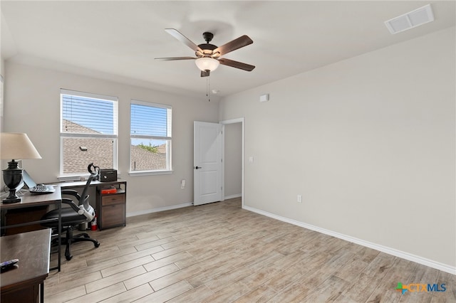 220 Bolivar Way Unit 101, San Marcos, TX 78666 - office space with light wood finished floors, a ceiling fan, and baseboards