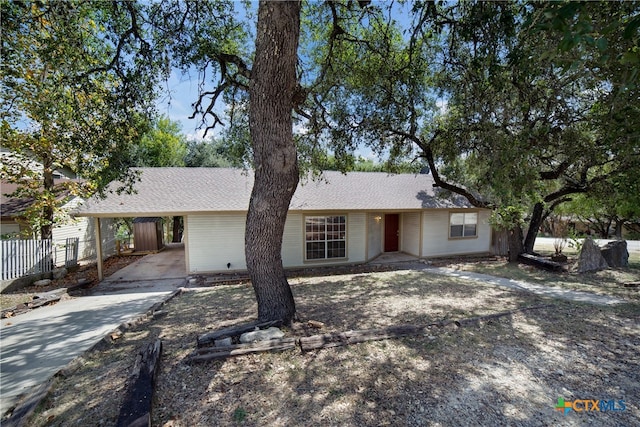 ranch-style house with a carport