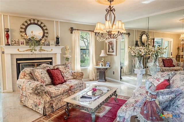 living room with ornamental molding, a fireplace, and a chandelier