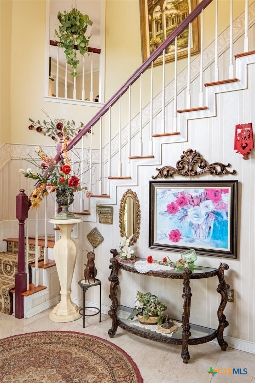 stairs featuring tile patterned floors