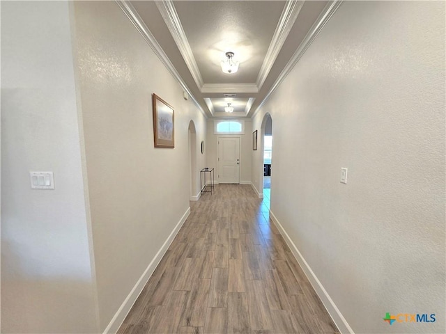 2635 Belle Hubbard Trl, Belton, TX 76513 - hallway with arched walkways, wood finished floors, ornamental molding, and baseboards