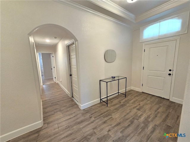 2635 Belle Hubbard Trl, Belton, TX 76513 - entrance foyer with arched walkways, wood finished floors, crown molding, and baseboards