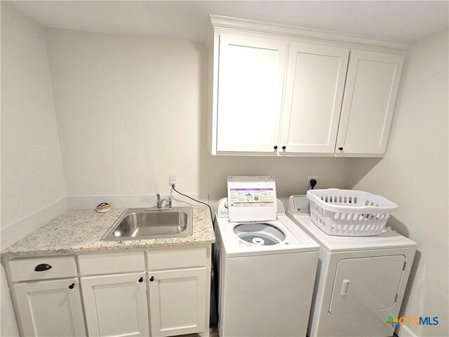 2635 Belle Hubbard Trl, Belton, TX 76513 - laundry room with cabinet space and separate washer and dryer
