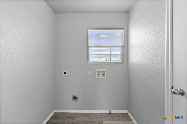 washroom featuring washer hookup, hardwood / wood-style floors, and hookup for an electric dryer