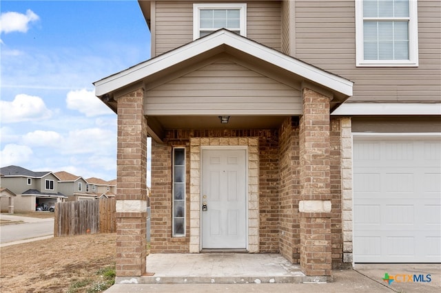 entrance to property featuring a garage