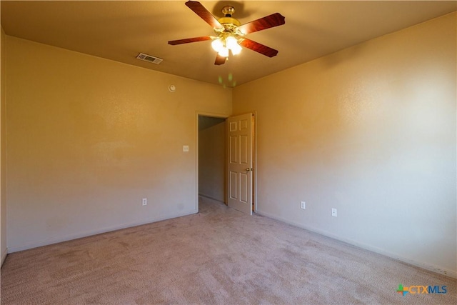 1513 Nicholas Cir, Killeen, TX 76542 - spare room with light colored carpet, ceiling fan, and baseboards