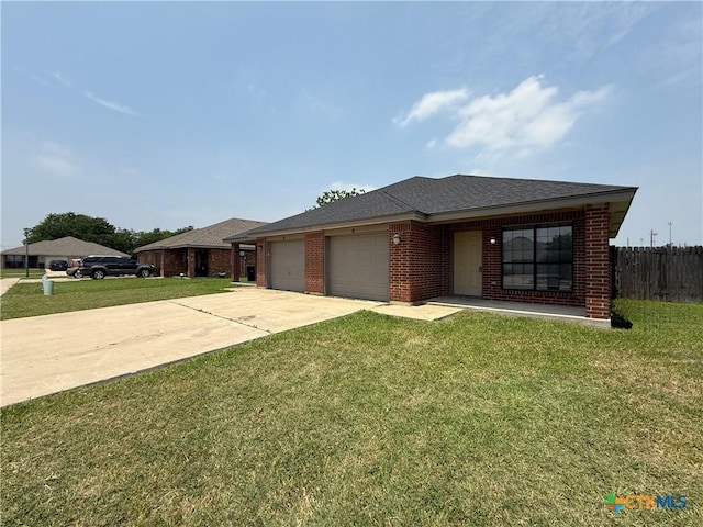 1513 Nicholas Cir, Killeen, TX 76542 - view of front of property featuring an attached garage, concrete driveway, brick siding, and a shingled roof