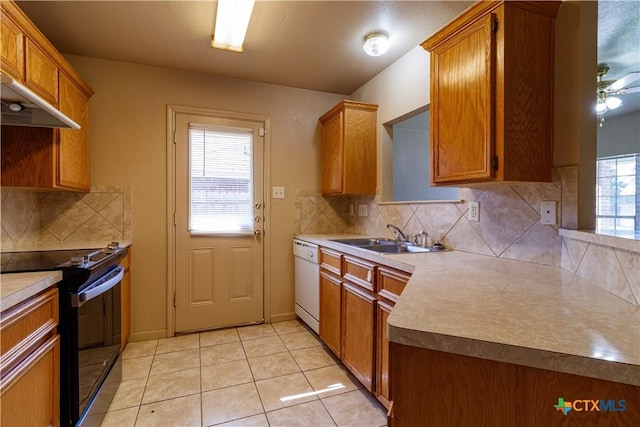1513 Nicholas Cir, Killeen, TX 76542 - kitchen with black / electric stove, a sink, white dishwasher, brown cabinets, and light tile patterned flooring
