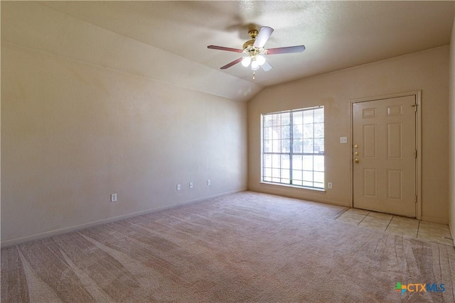 1513 Nicholas Cir, Killeen, TX 76542 - spare room featuring light carpet, ceiling fan, baseboards, and lofted ceiling
