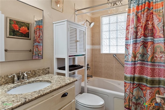 full bathroom with vanity, toilet, and shower / bath combo with shower curtain