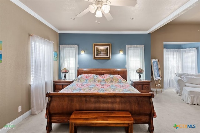 bedroom with baseboards, light colored carpet, ceiling fan, and crown molding