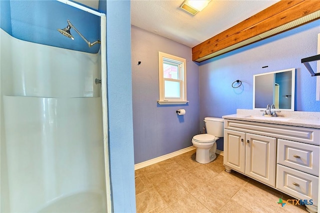 bathroom featuring vanity, toilet, and a shower