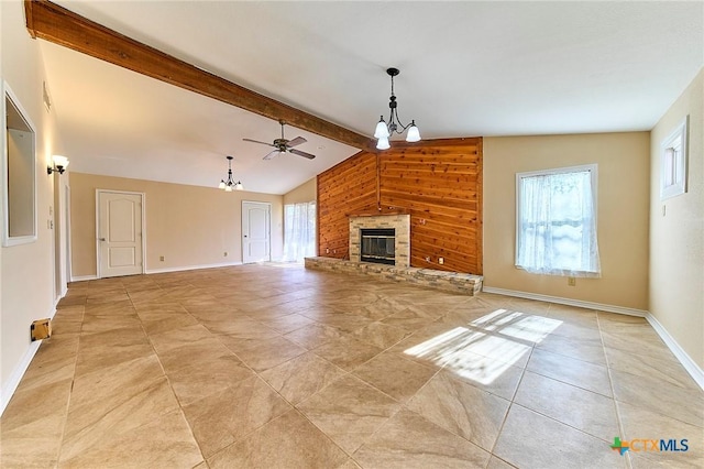 unfurnished living room featuring ceiling fan with notable chandelier, wooden walls, and lofted ceiling with beams