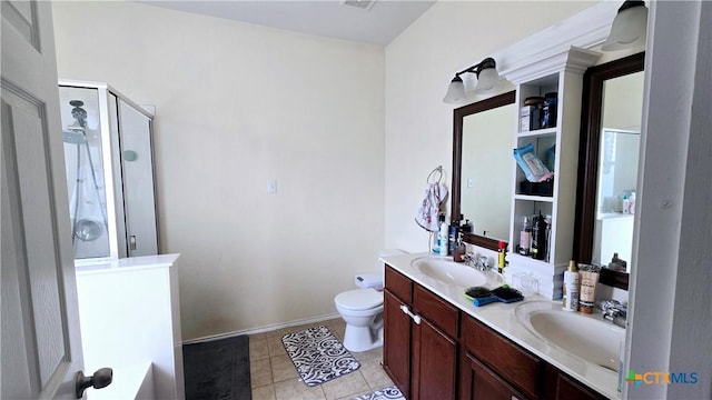 full bathroom with double vanity, a stall shower, a sink, and tile patterned floors