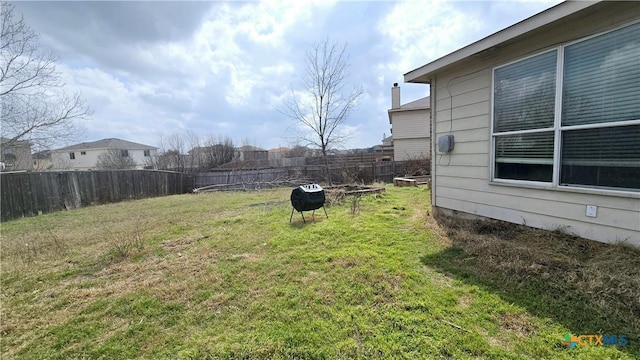 view of yard with a fenced backyard