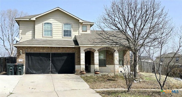 5200 Milky Way Ave, Killeen, TX 76542 - traditional-style home featuring a porch, driveway, brick siding, a shingled roof, and a garage