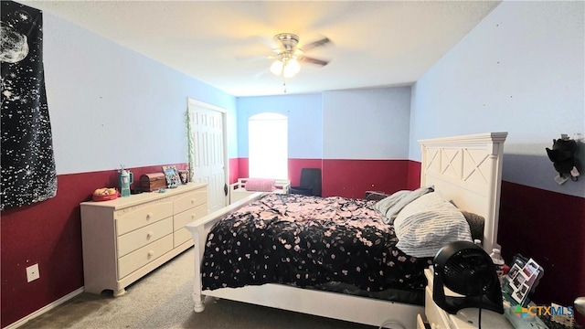 carpeted bedroom with a ceiling fan