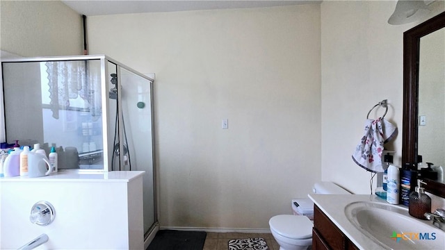 full bathroom with toilet, a shower stall, vanity, and baseboards