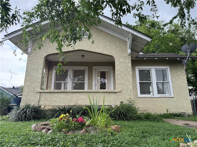 view of side of property featuring stucco siding