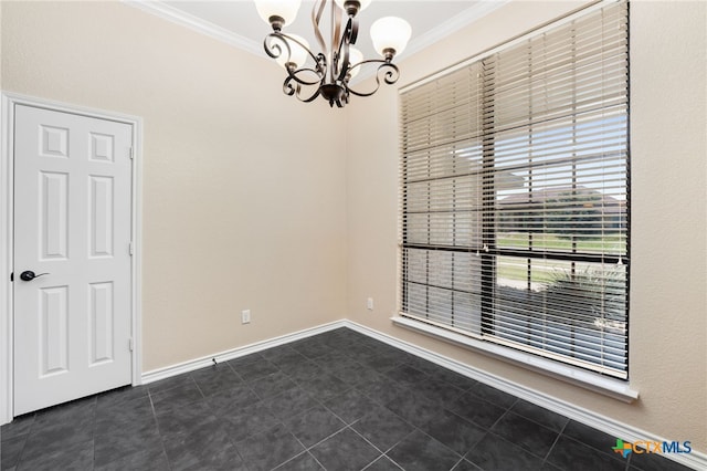 tiled spare room featuring a chandelier and crown molding