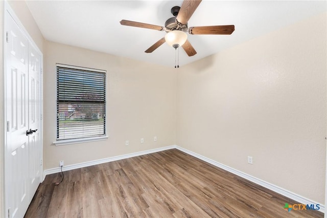 2222 Sparrow Rd, Killeen, TX 76542 - empty room featuring wood finished floors, baseboards, and a ceiling fan
