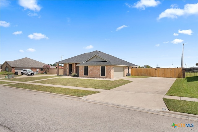 ranch-style house with a garage and a front yard