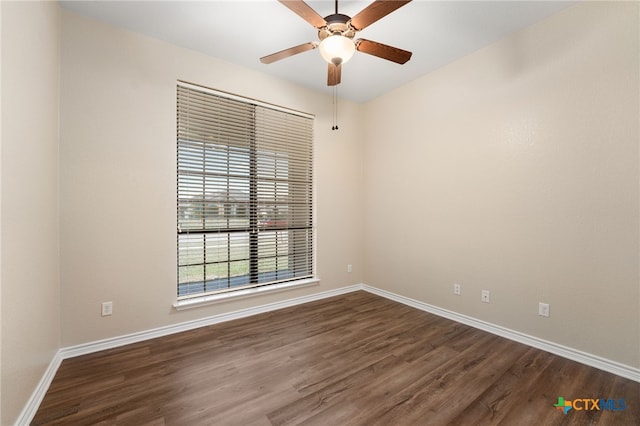 unfurnished room featuring ceiling fan and dark hardwood / wood-style flooring