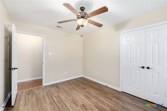2222 Sparrow Rd, Killeen, TX 76542 - unfurnished bedroom featuring wood finished floors, baseboards, a closet, and ceiling fan