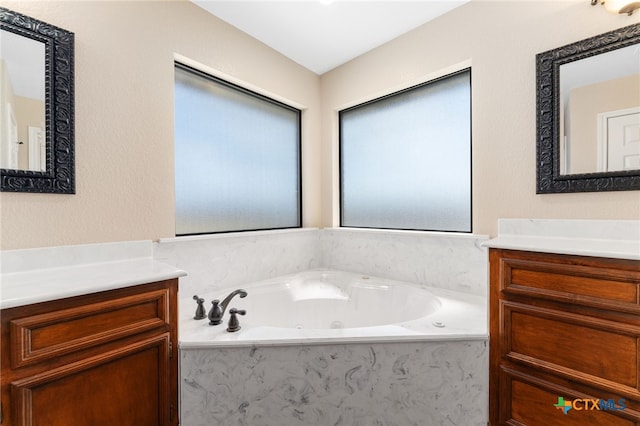 bathroom featuring a bathing tub and vanity