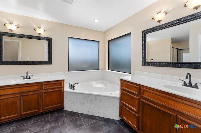 2222 Sparrow Rd, Killeen, TX 76542 - full bathroom featuring tile patterned floors, two vanities, a bath, and a shower stall