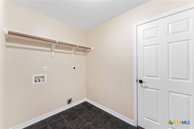 laundry room with hookup for a washing machine, hookup for an electric dryer, and dark tile patterned flooring