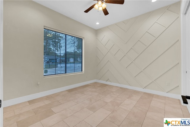 unfurnished room with light tile patterned flooring and ceiling fan