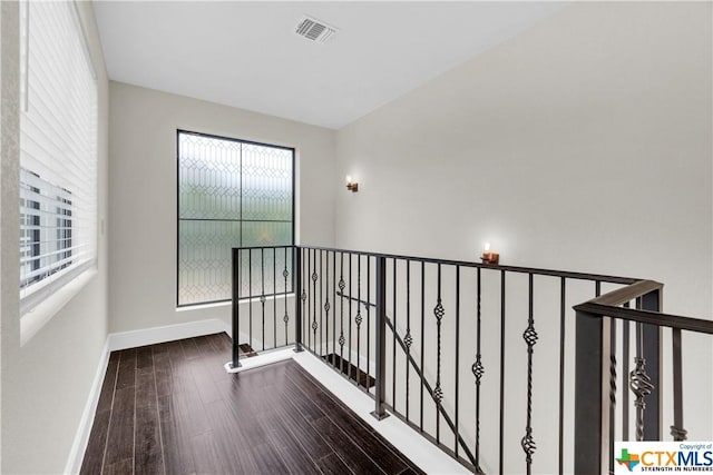 12312 White Birch St, San Antonio, TX 78245 - hall featuring wood-type flooring, baseboards, and an upstairs landing