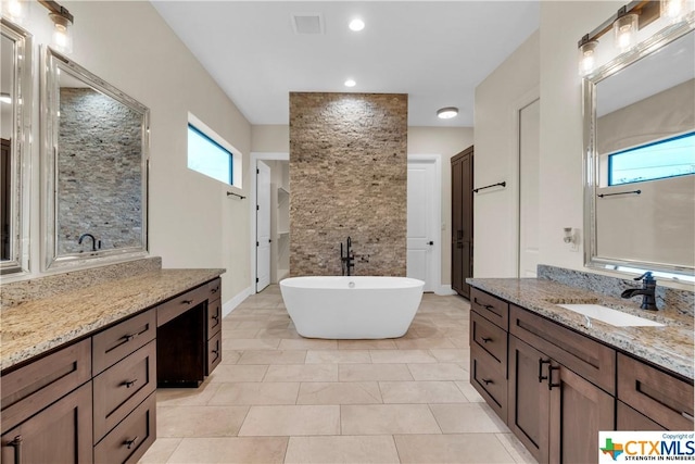 12312 White Birch St, San Antonio, TX 78245 - full bath with a shower stall, a soaking tub, and vanity
