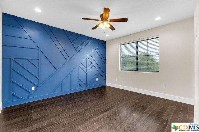 12312 White Birch St, San Antonio, TX 78245 - spare room with baseboards, a ceiling fan, dark wood-style floors, and a decorative wall