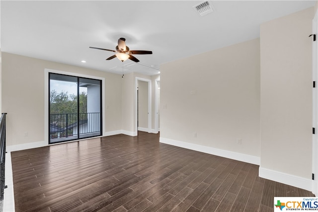 unfurnished living room featuring dark wood-type flooring and ceiling fan