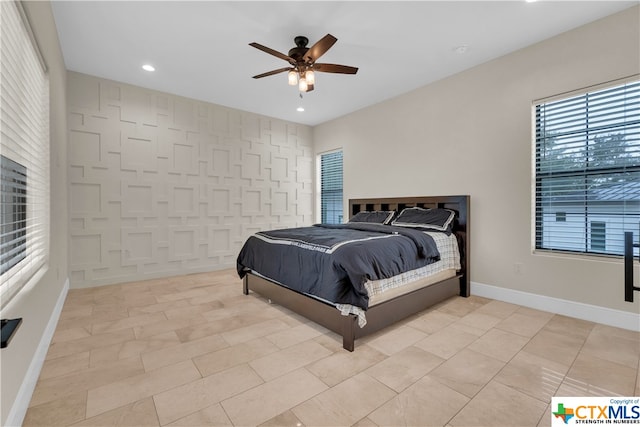 bedroom featuring light tile patterned flooring and ceiling fan