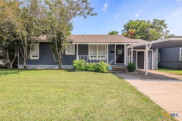 ranch-style home with a front yard, a carport, and a porch