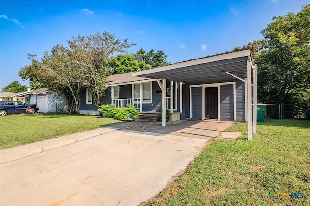 view of front facade featuring a front yard, a carport, and a porch