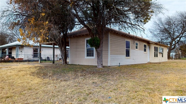 view of home's exterior with a yard