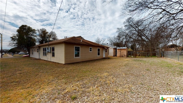 view of home's exterior with a yard