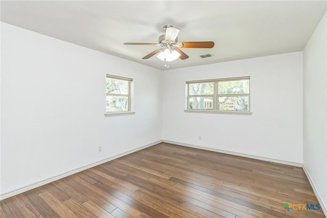 102 Norcrest Dr, San Marcos, TX 78666 - spare room featuring wood-type flooring, ceiling fan, and baseboards