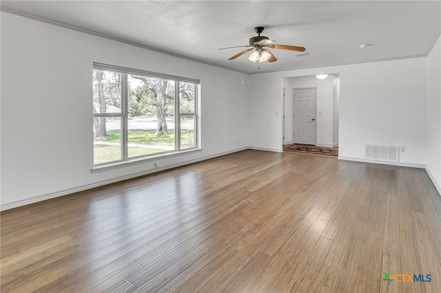 102 Norcrest Dr, San Marcos, TX 78666 - empty room featuring ceiling fan, wood finished floors, and baseboards