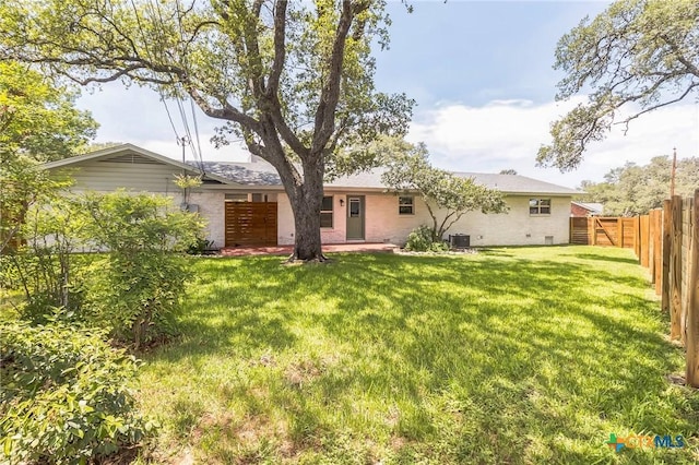 102 Norcrest Dr, San Marcos, TX 78666 - back of house featuring brick siding