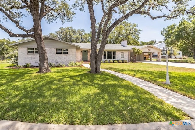102 Norcrest Dr, San Marcos, TX 78666 - single story home with driveway, a front lawn, a chimney, and brick siding