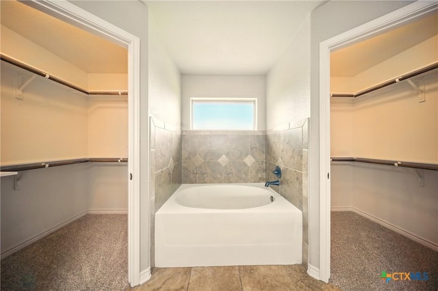 412 Coventry Dr, Temple, TX 76502 - bathroom featuring a spacious closet and a garden tub